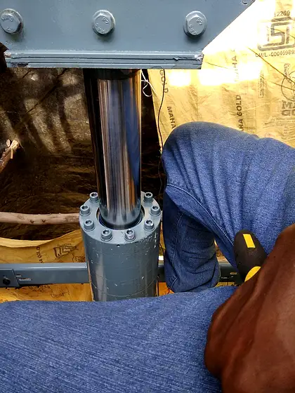 HLA crew at work: rails, cylinder and power pack