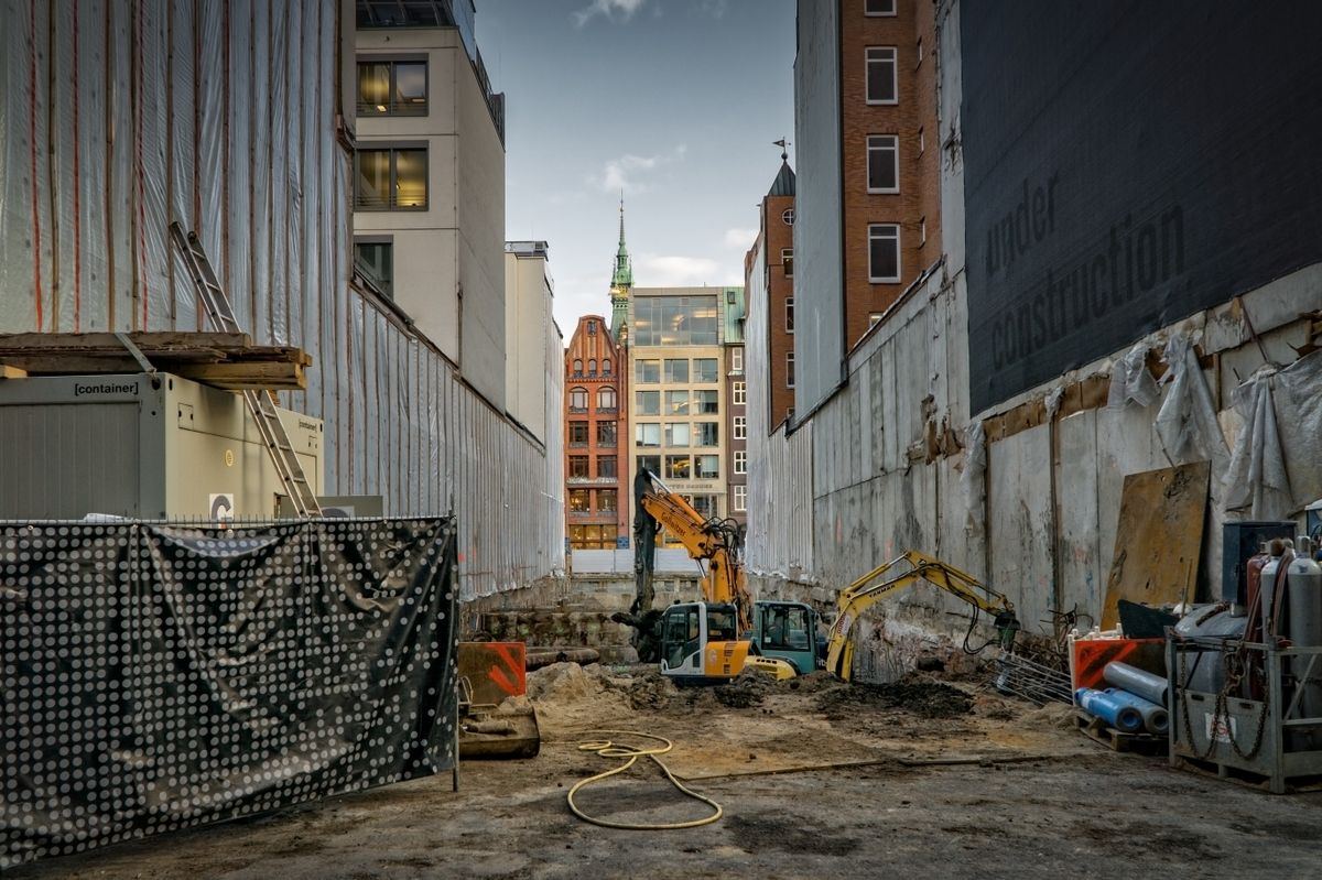 Construction site with excavators and scaffolding