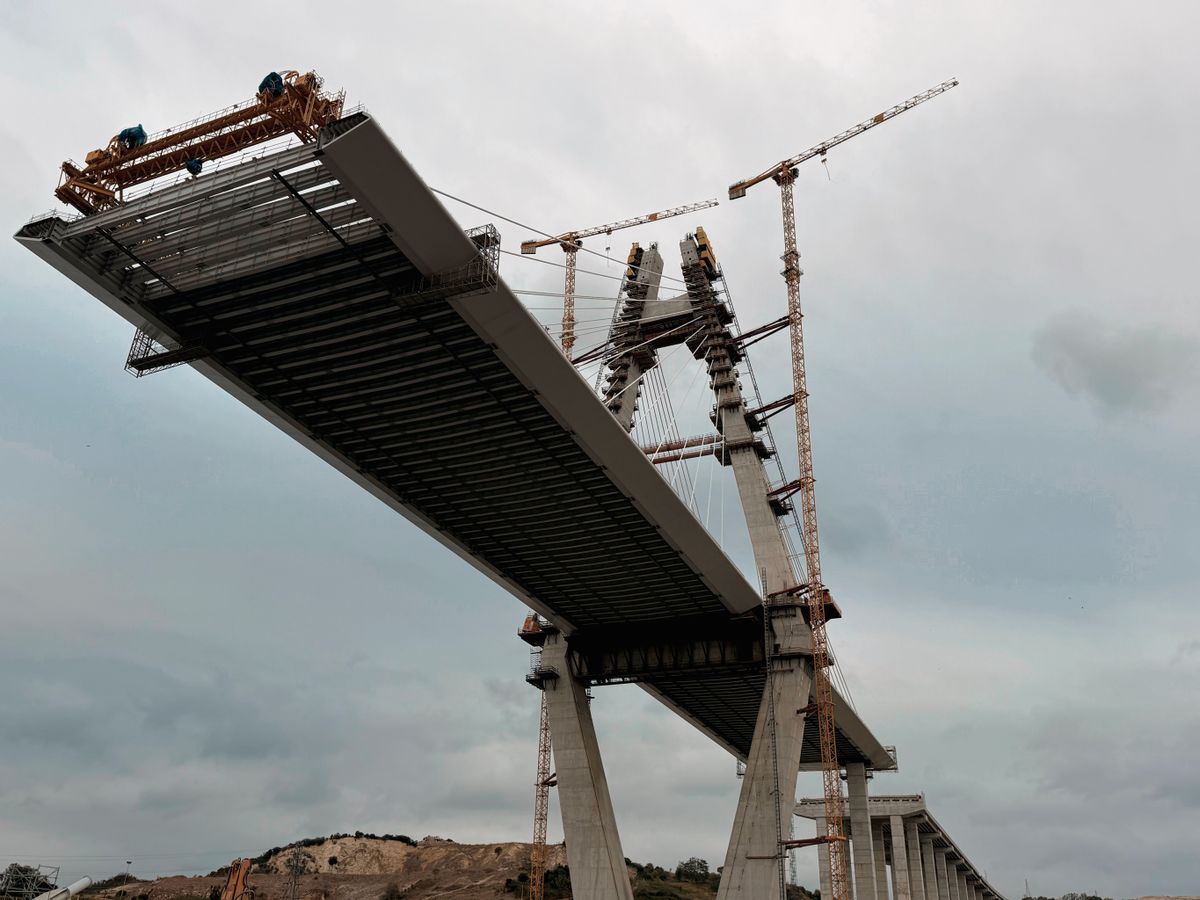 Bridge under construction with cranes